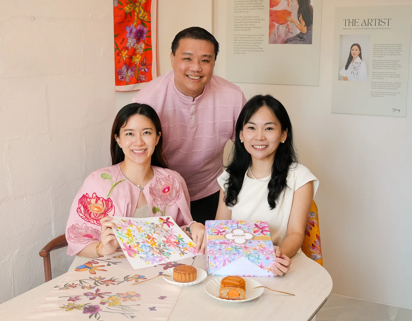 Phuay Li Ying, Jacob Soo and Evelyn Lim at the table with The Painted Garden artwork and box