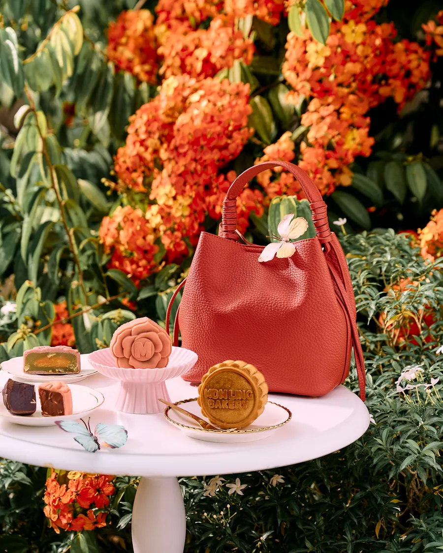 The Dusk leather gift bag among the flowers